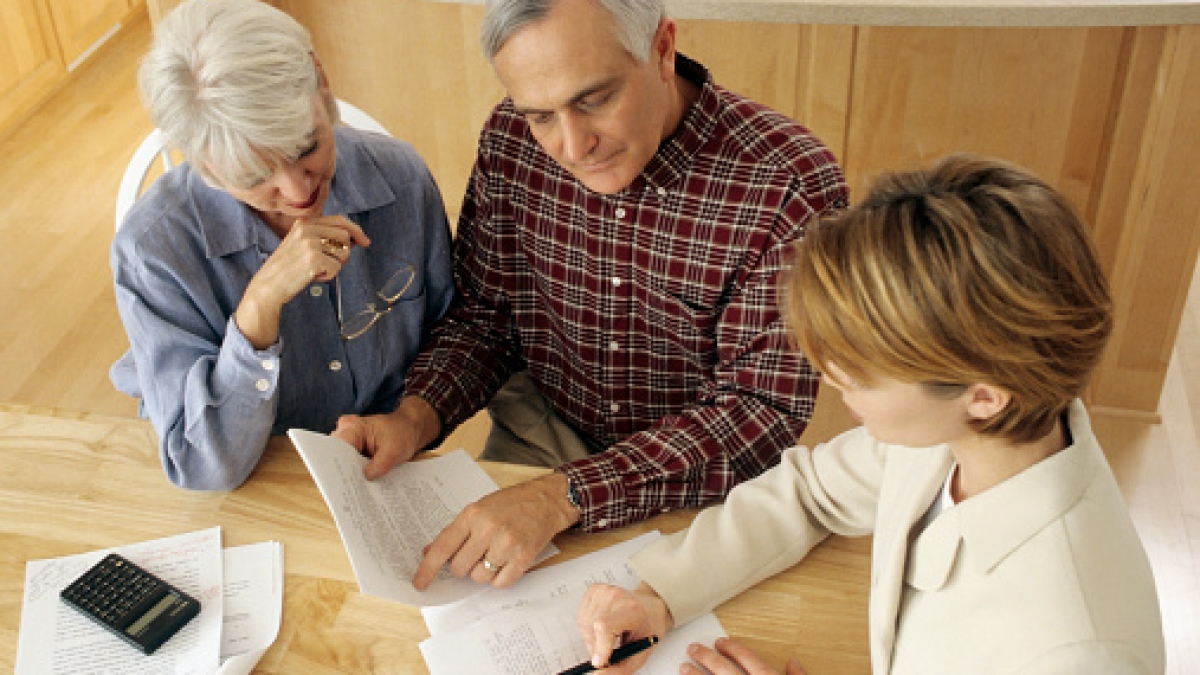 Senior couple meeting with agent